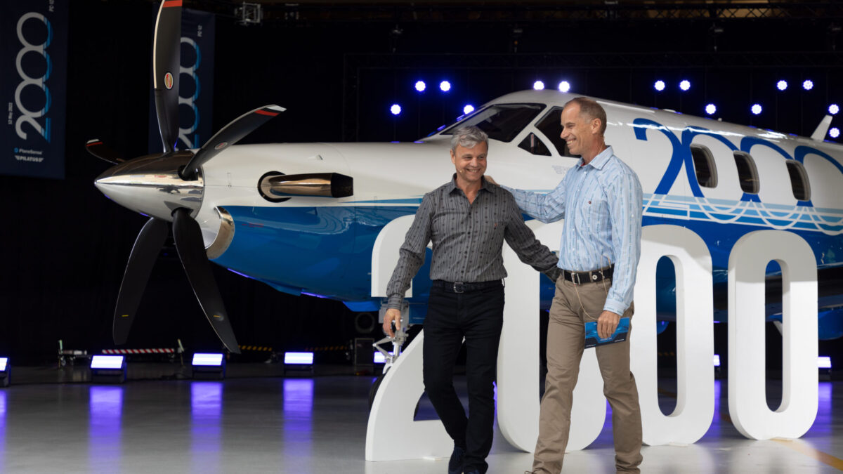 2 Men in front of PlaneSense Jet